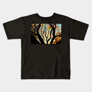 Massive branches of a beech tree with yellow leaves sunlit from behind in Canfaito forest Kids T-Shirt